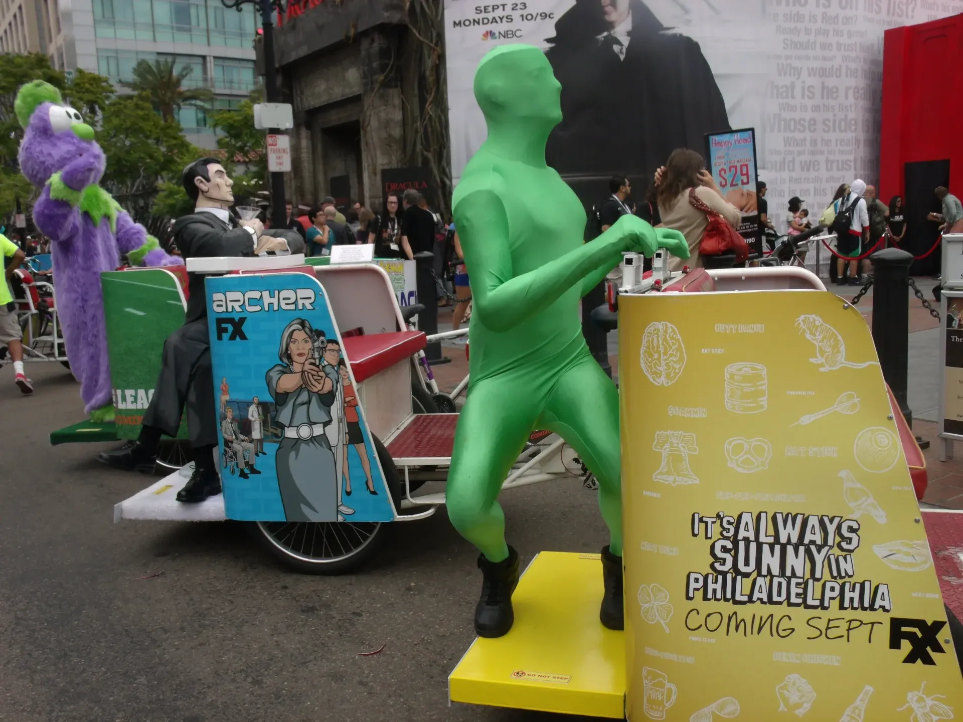 Archer FX and Always Sunny Green Man pedicab at Comic-Con