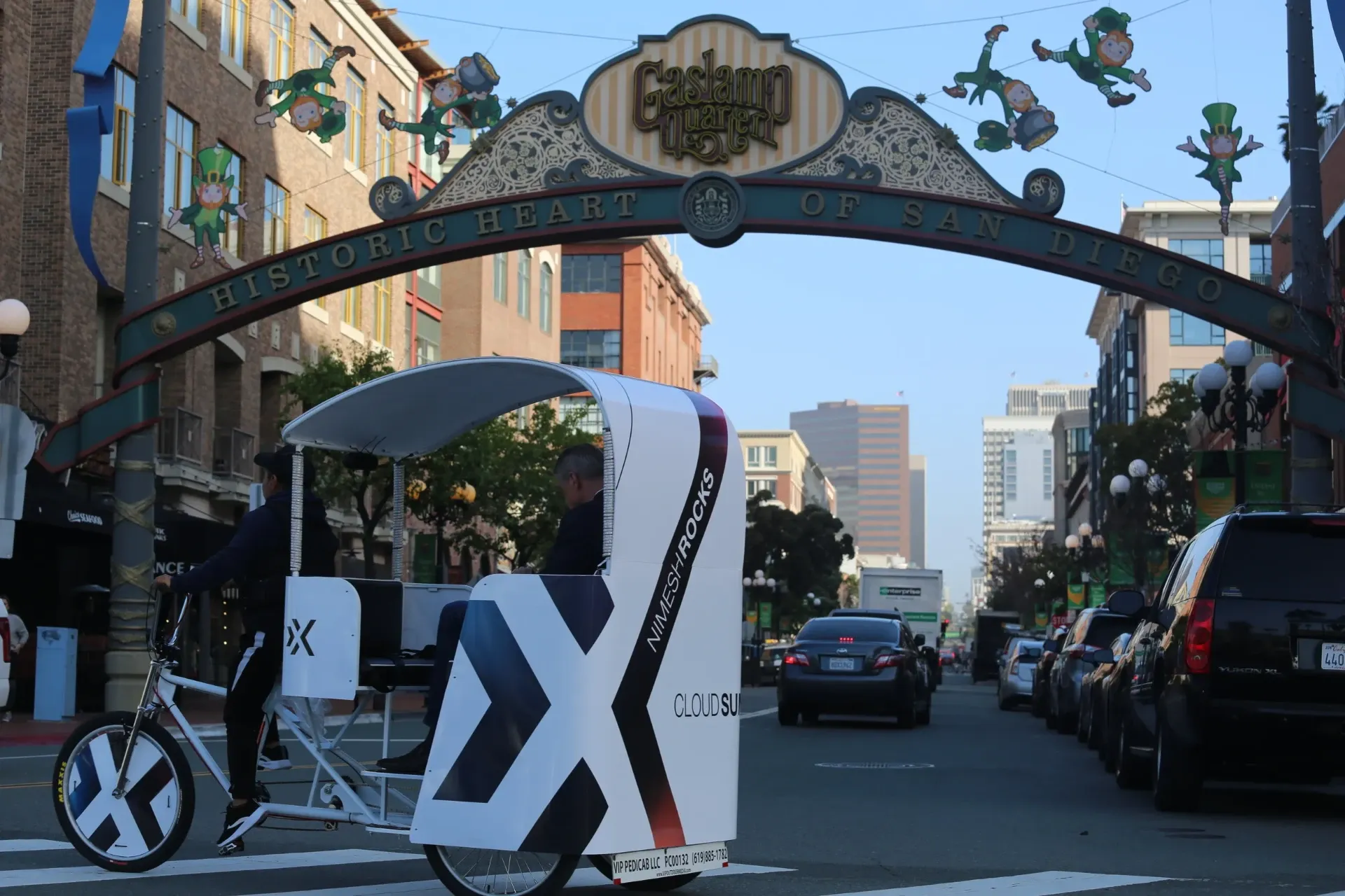 Branded pedicab under Gaslamp Quarter archway at Comic-Con