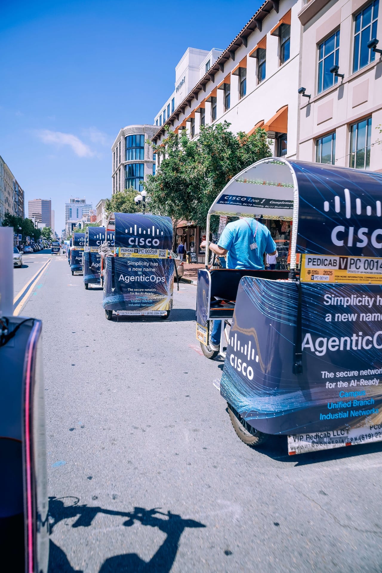 Cisco AgenticOps branded pedicab wrap fleet in downtown San Diego