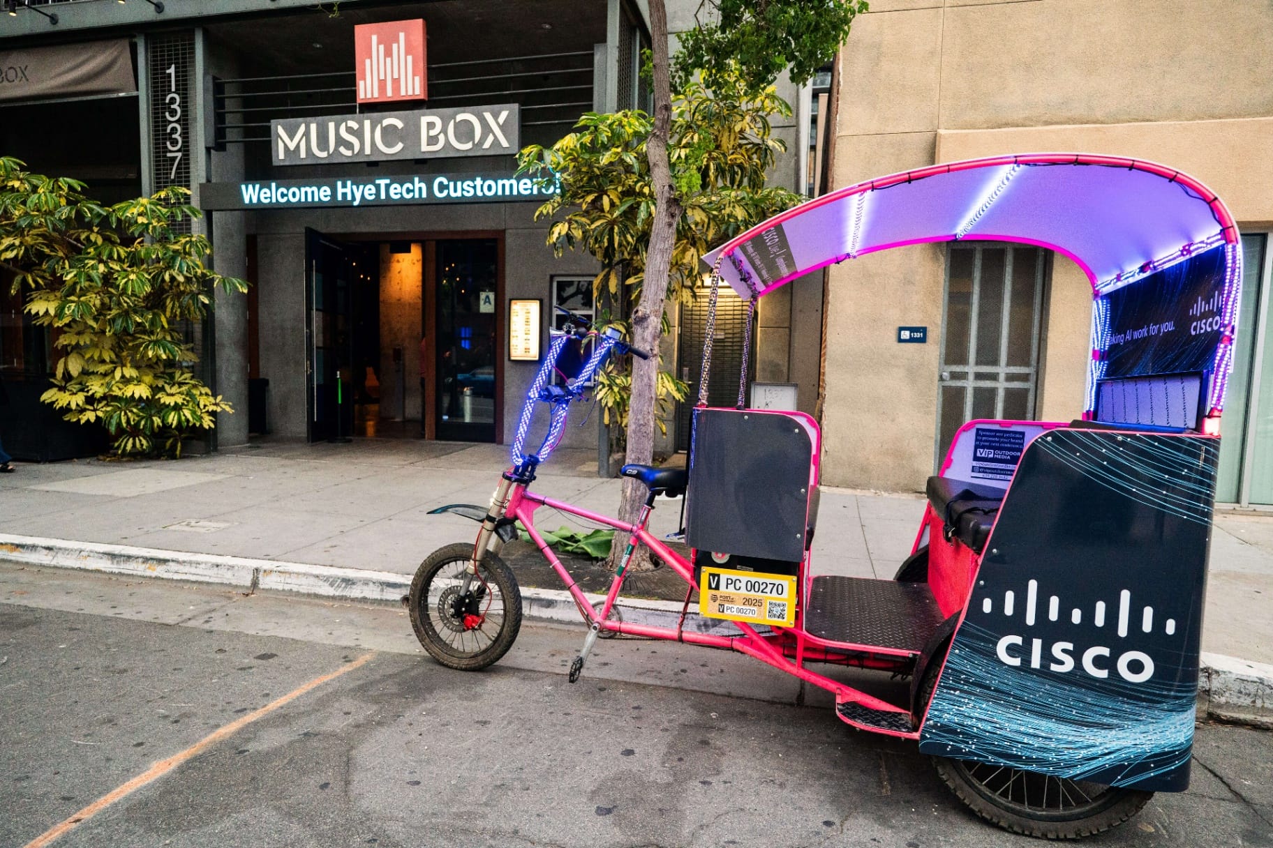 Cisco Live branded pedicab with LED lights outside Music Box venue San Diego
