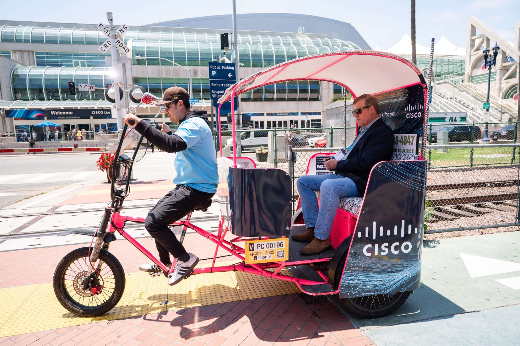 Cisco Live pedicab rider transporting passenger near Convention Center Embarcadero