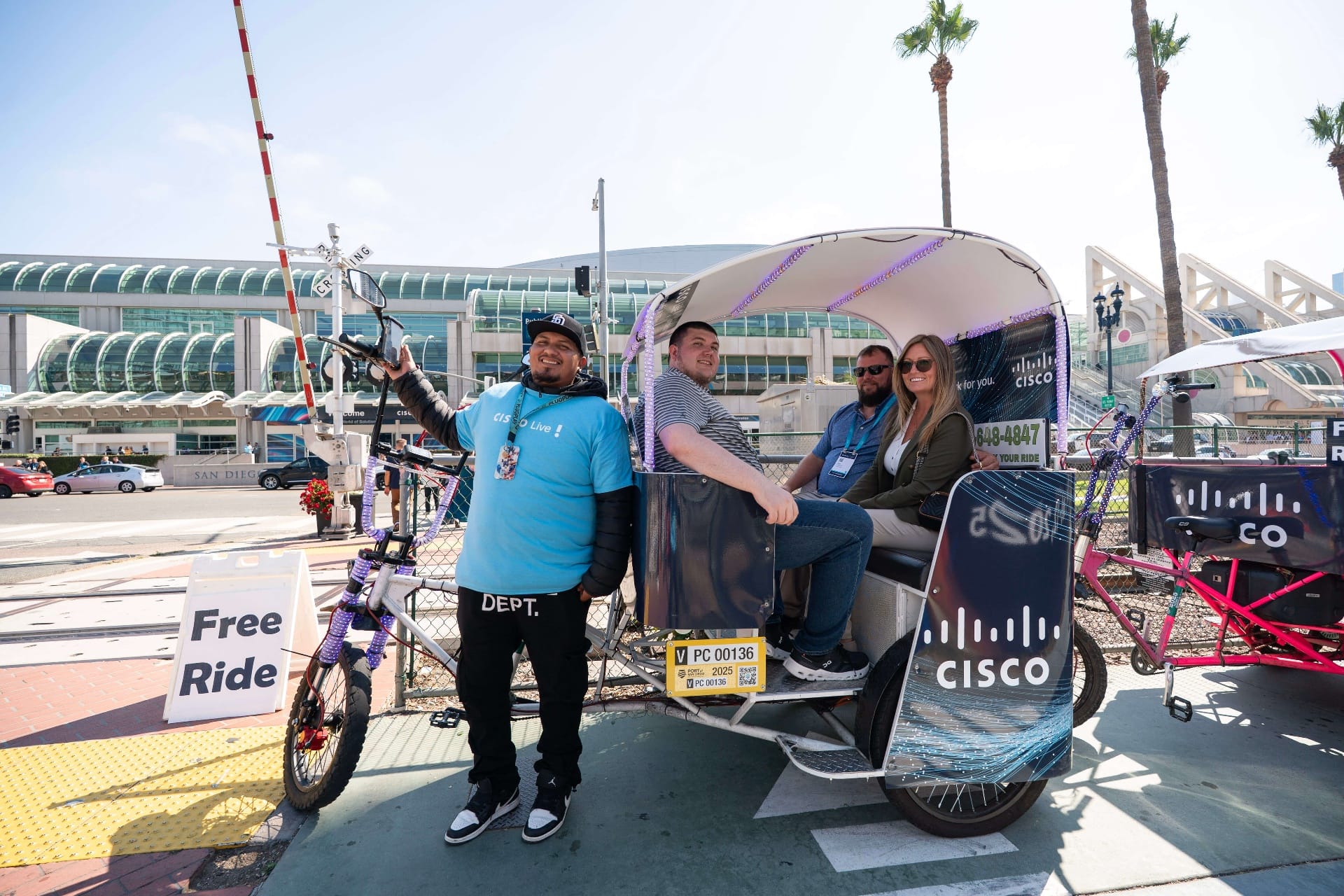 Cisco pedicab driver giving thumbs up at Convention Center crossing