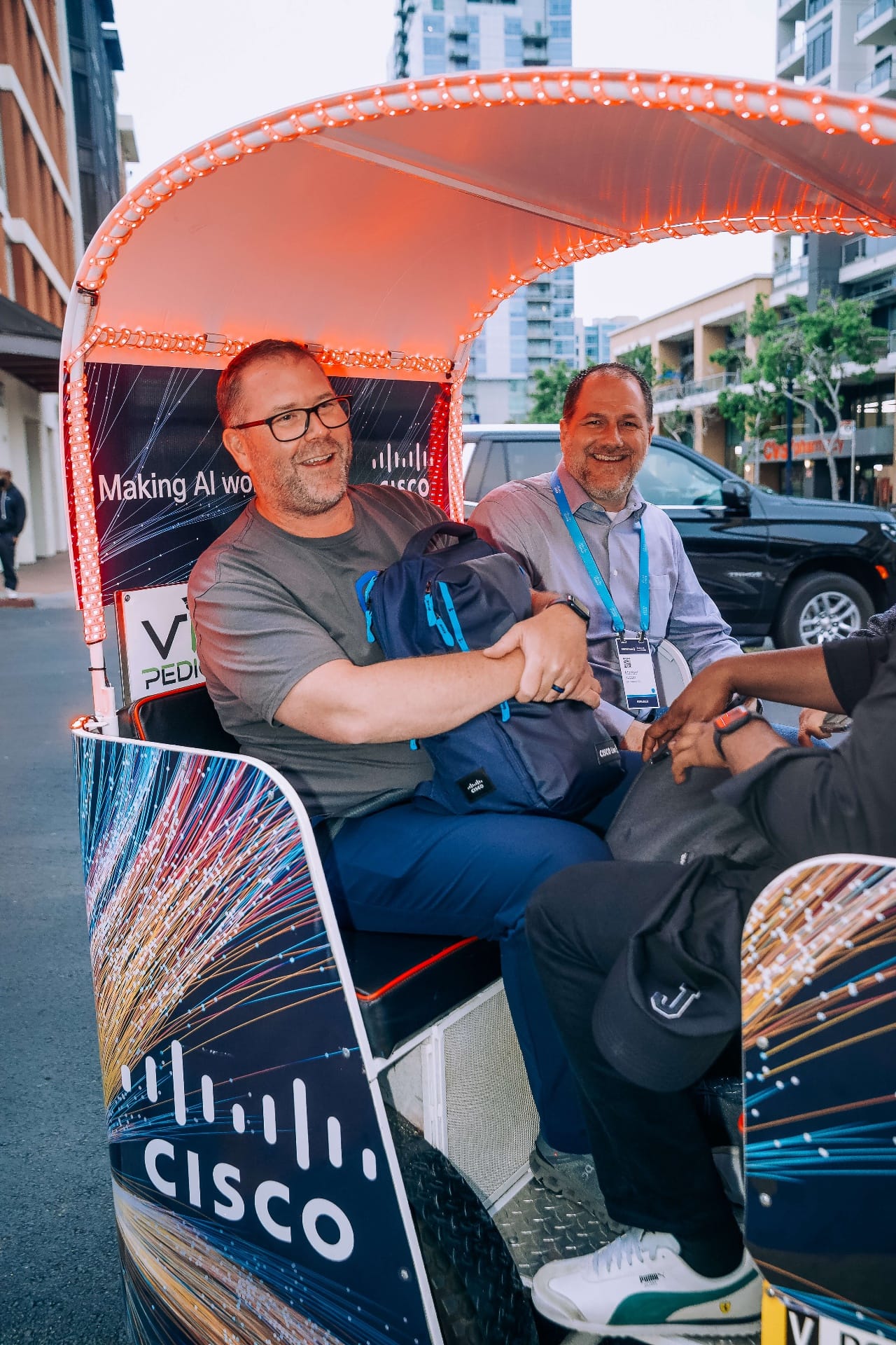 Cisco pedicab passengers with LED lights during evening ride San Diego
