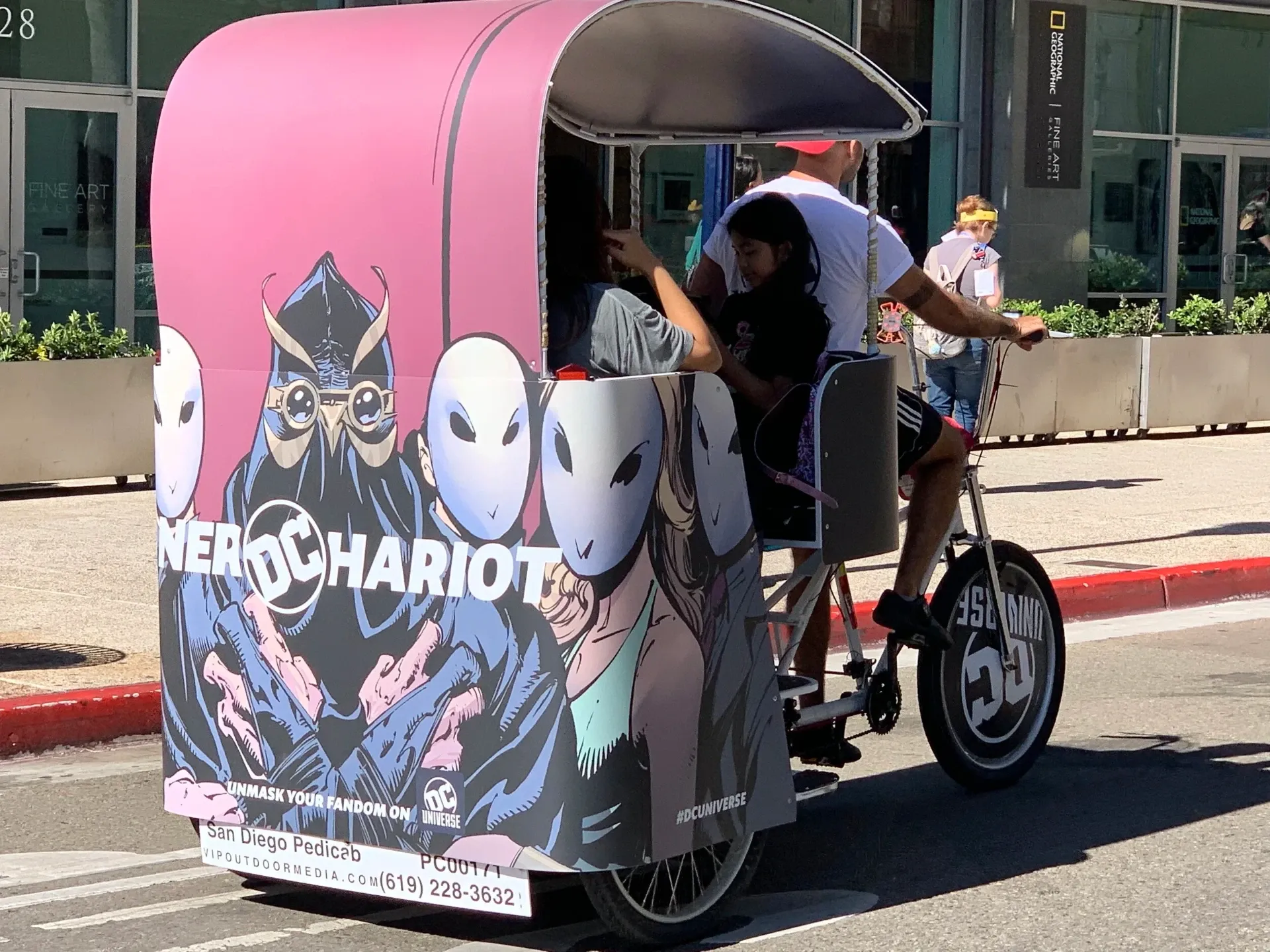 DC Universe Nerd Chariot pink pedicab with passengers Comic-Con