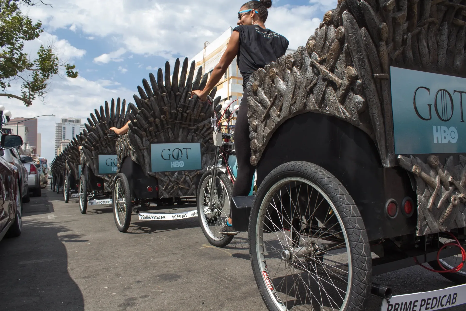 HBO Game of Thrones Iron Throne pedicab fleet lined up at Comic-Con