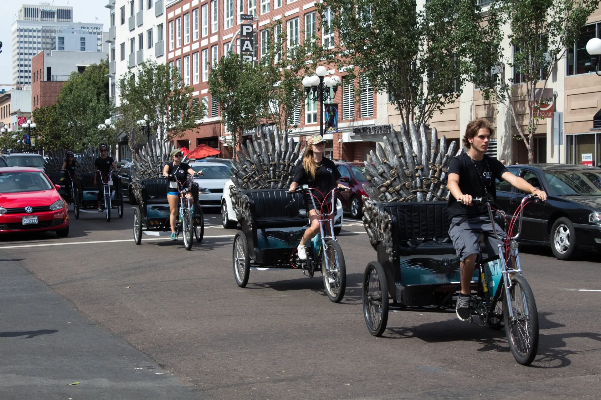 Game of Thrones Iron Throne pedicab drivers riding downtown Comic-Con