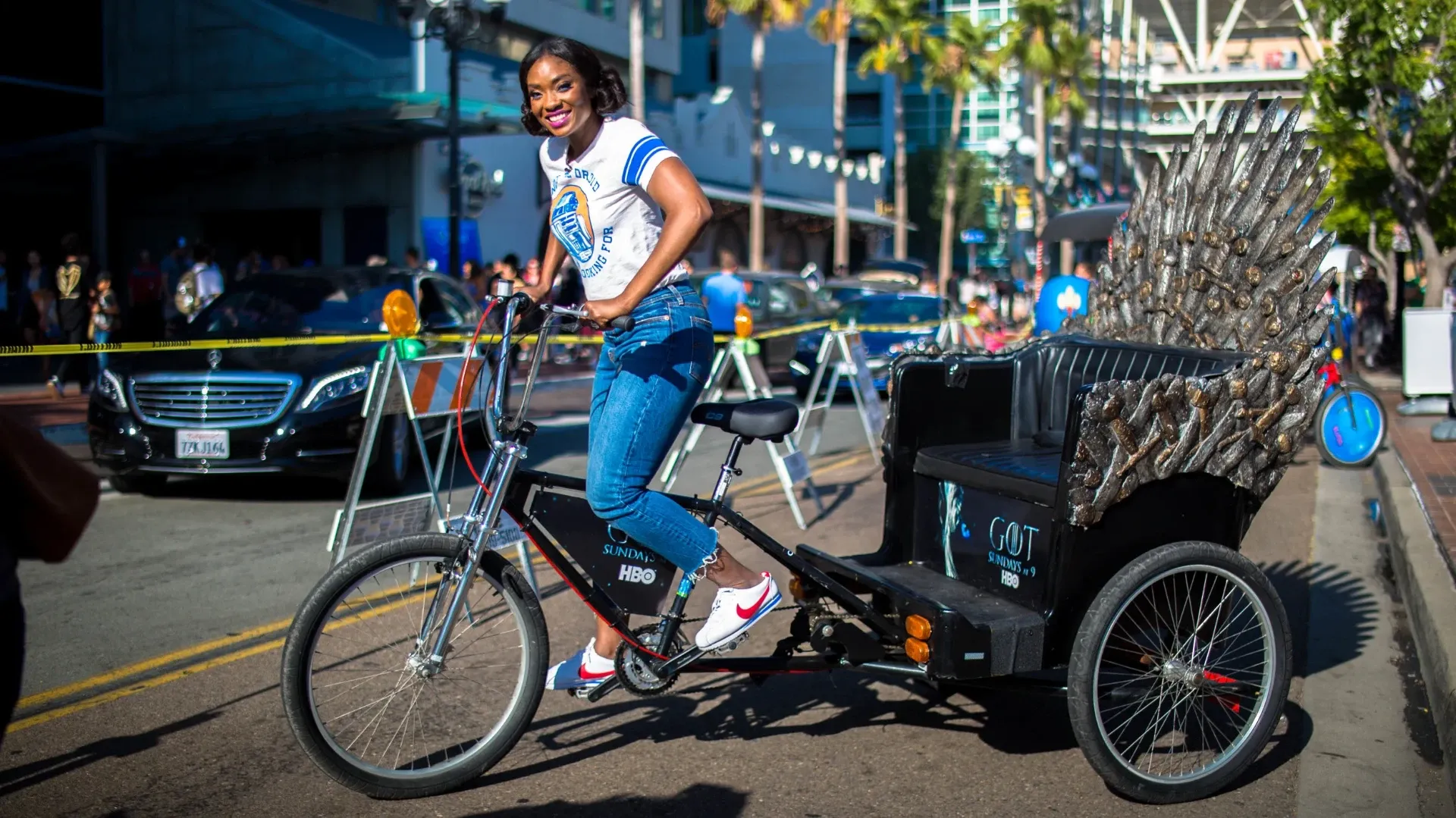 Game of Thrones pedicab driver on Iron Throne at Comic-Con