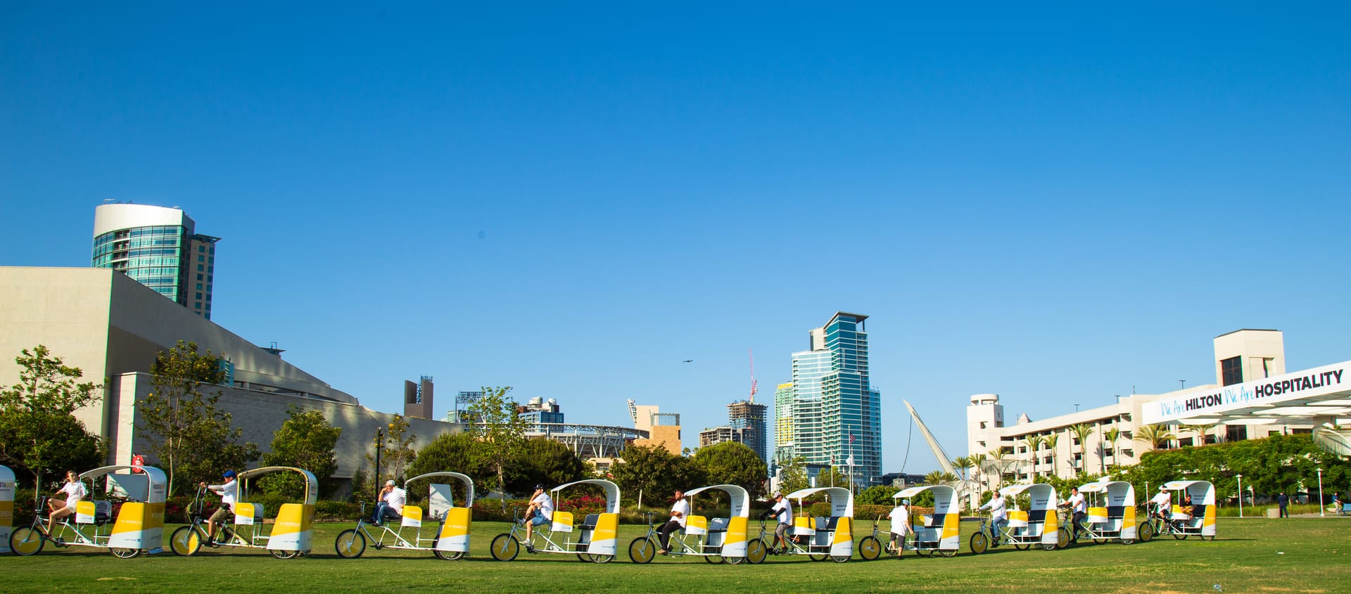 Branded pedicab fleet with the San Diego downtown skyline
