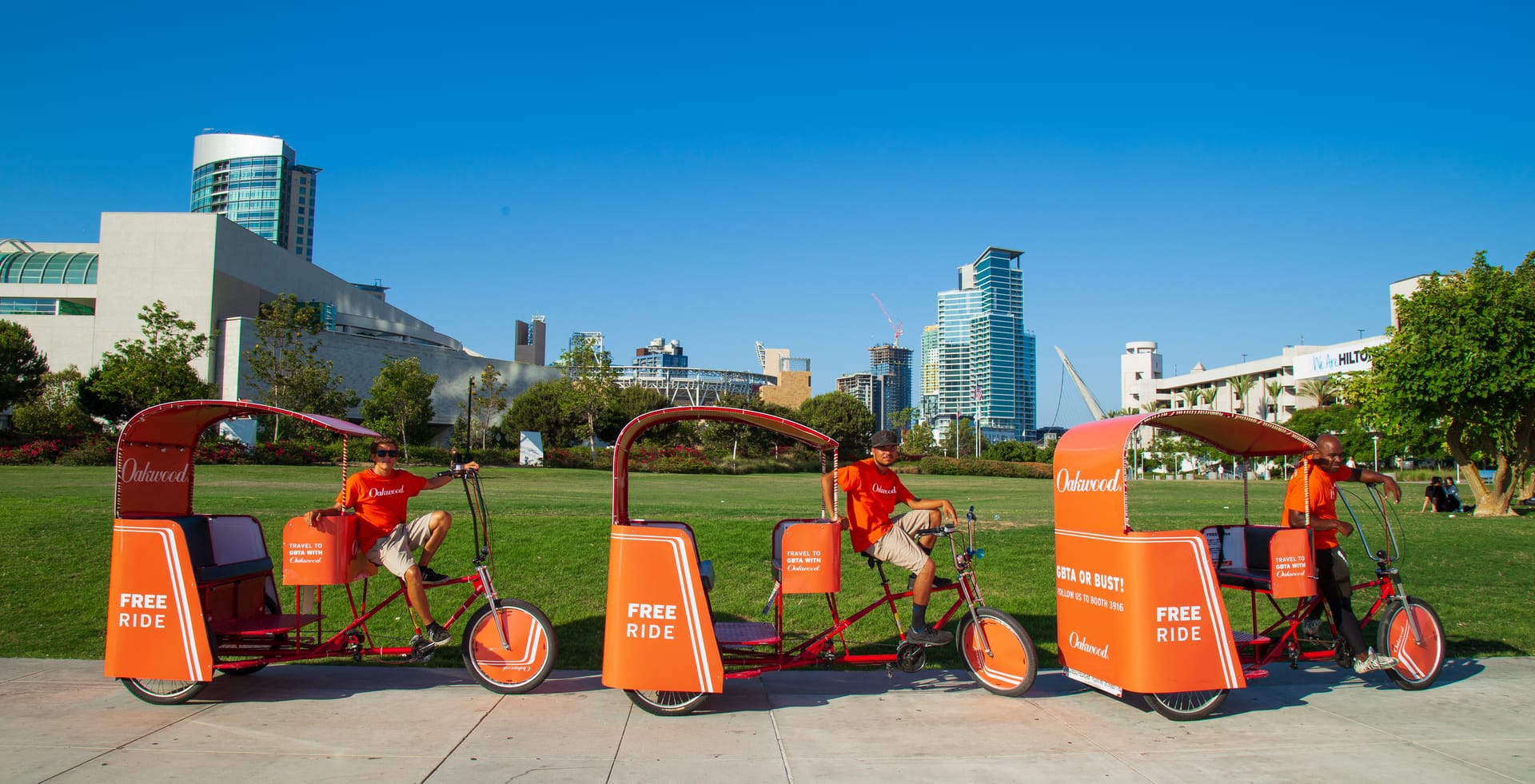 Oakwood branded pedicab fleet with the San Diego downtown skyline