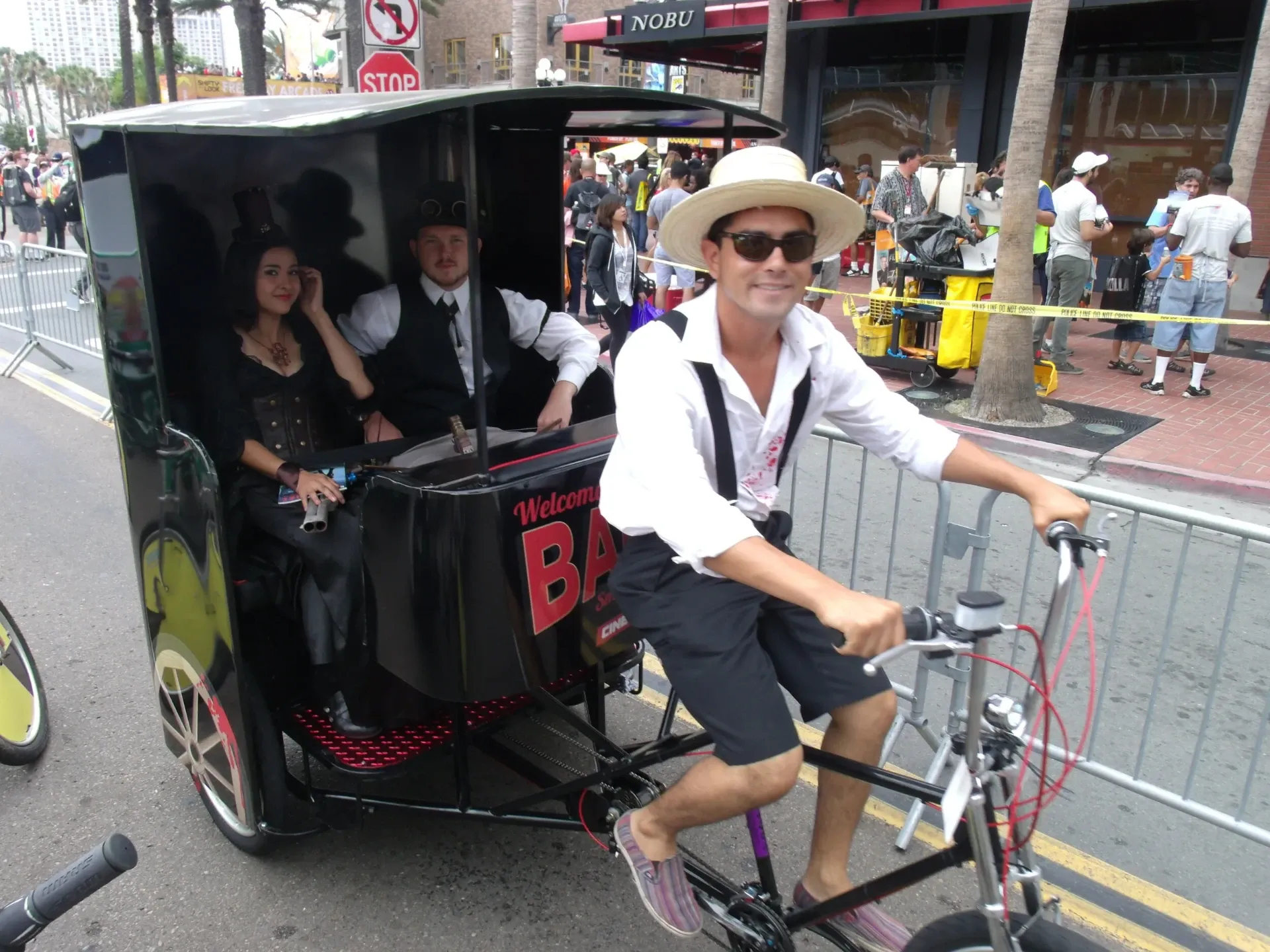 Pedicab driver in cosplay with passengers Gaslamp Quarter Comic-Con