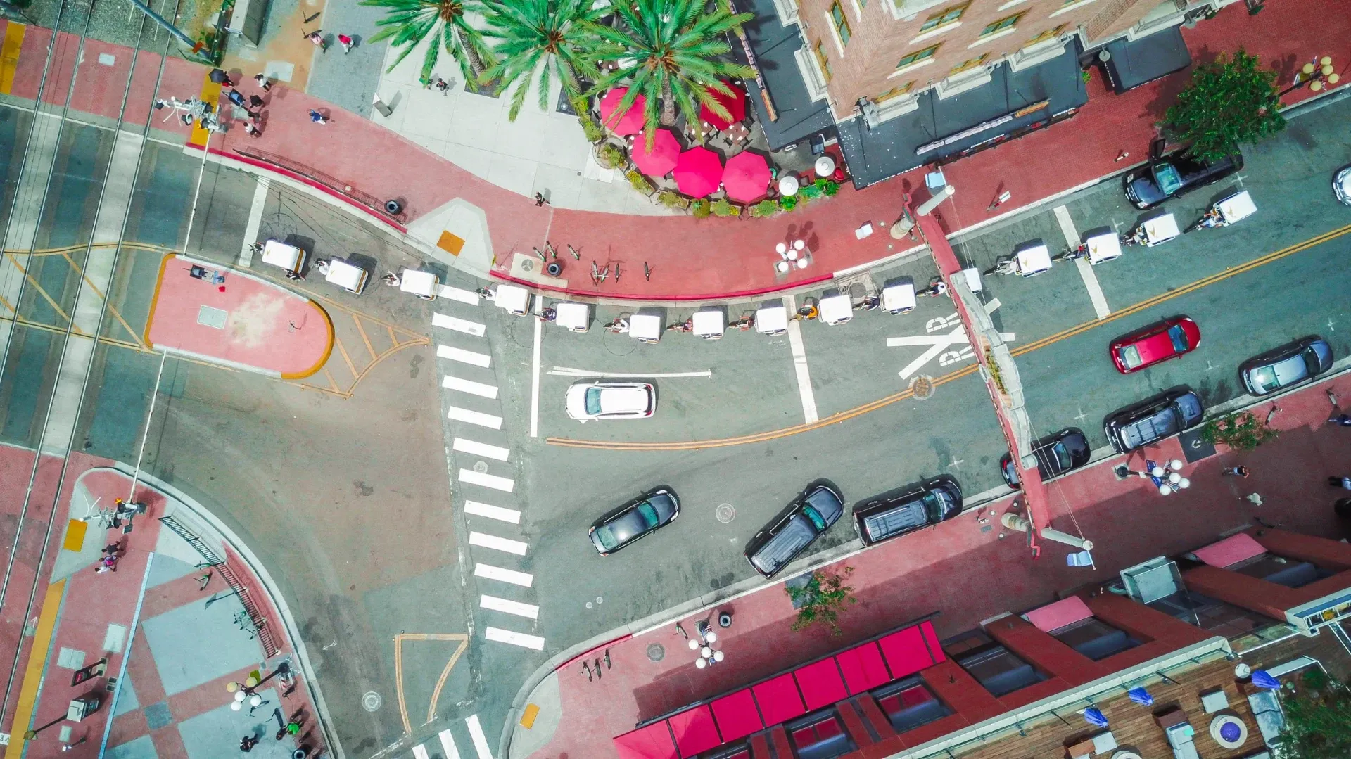 Drone aerial view of pedicab fleet at Gaslamp Quarter intersection San Diego