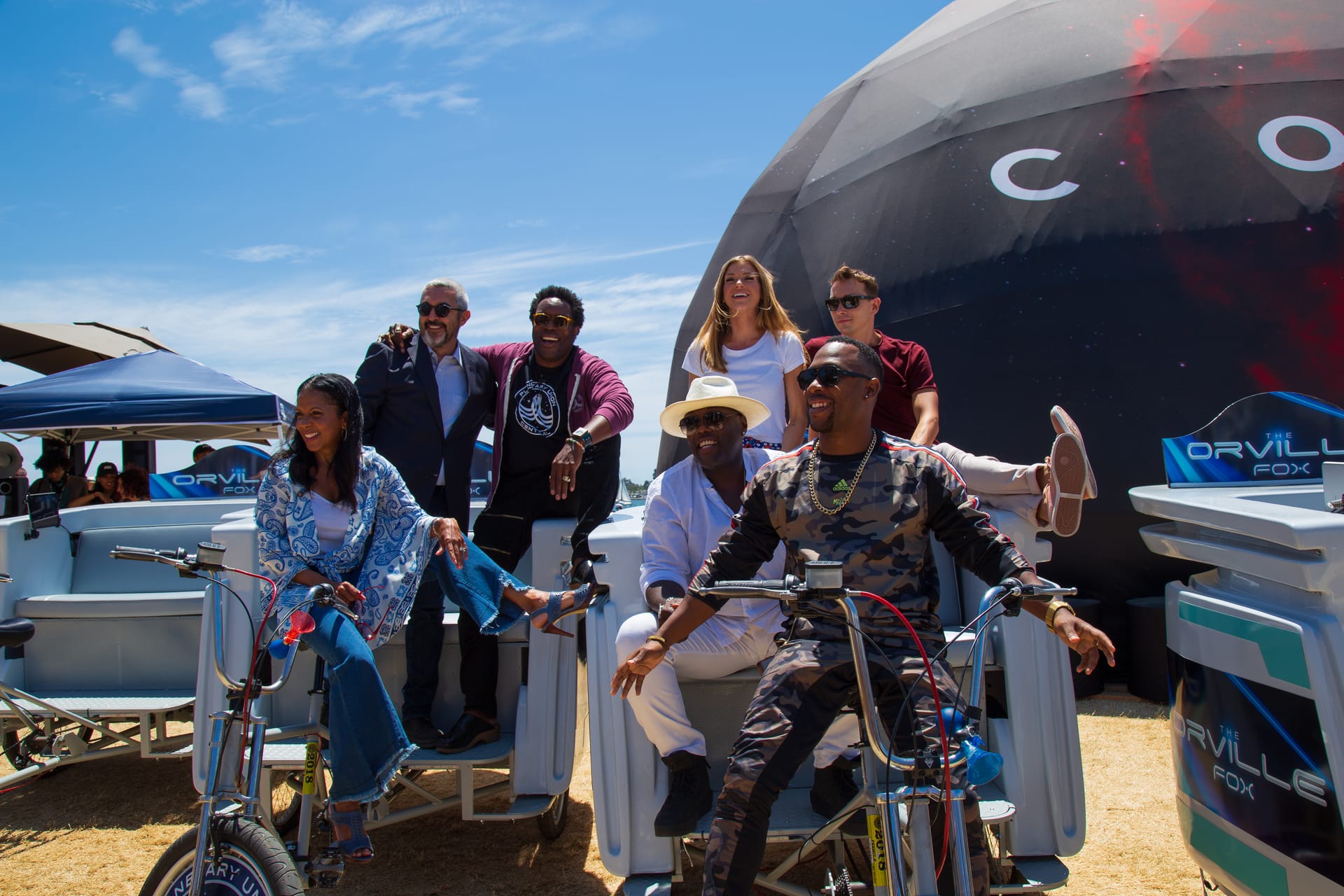 Cast riding Fox The Orville pedicabs at the Cosmos dome, San Diego Comic-Con