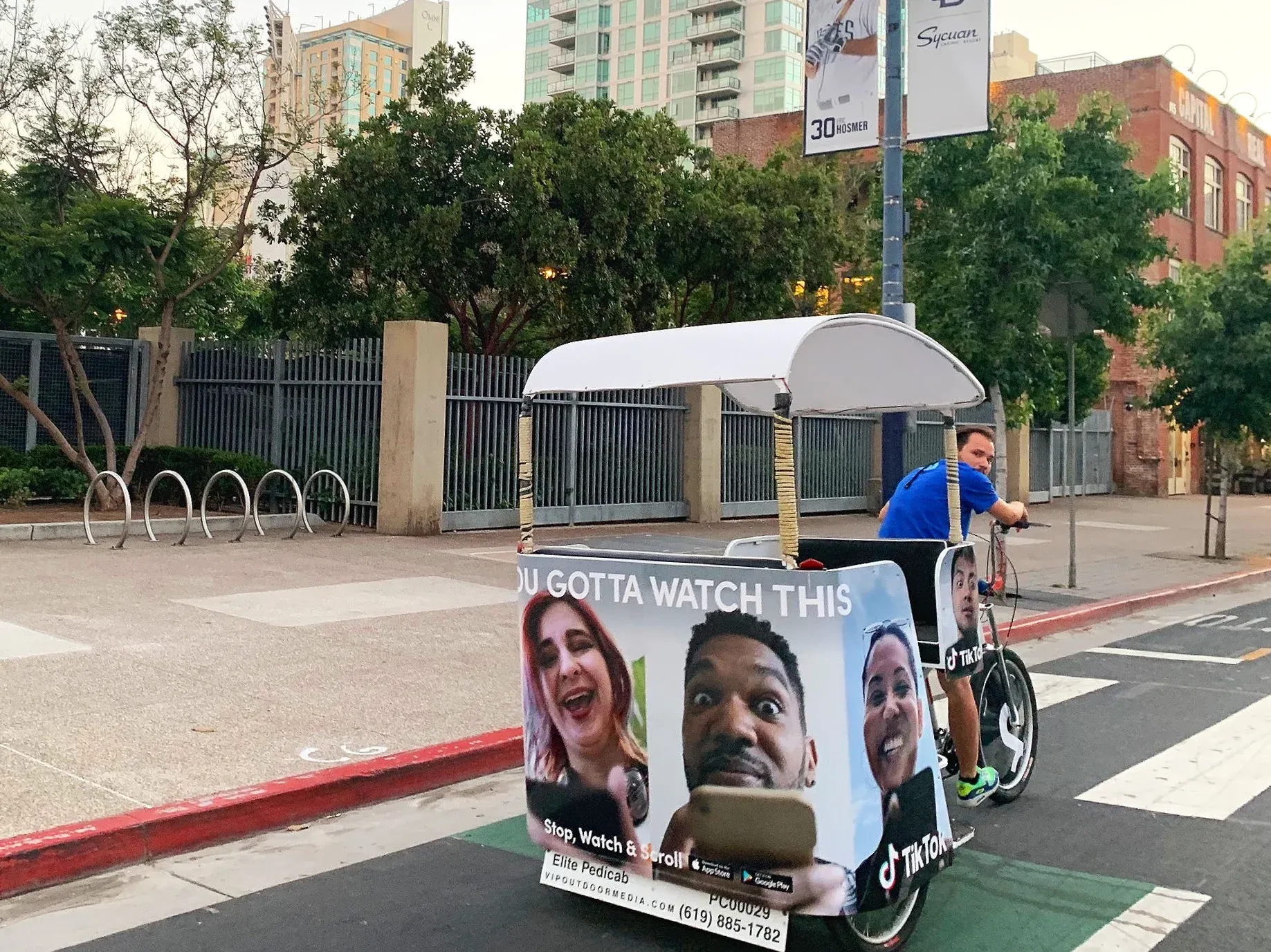 TikTok pedicab wrap with driver in downtown San Diego Comic-Con