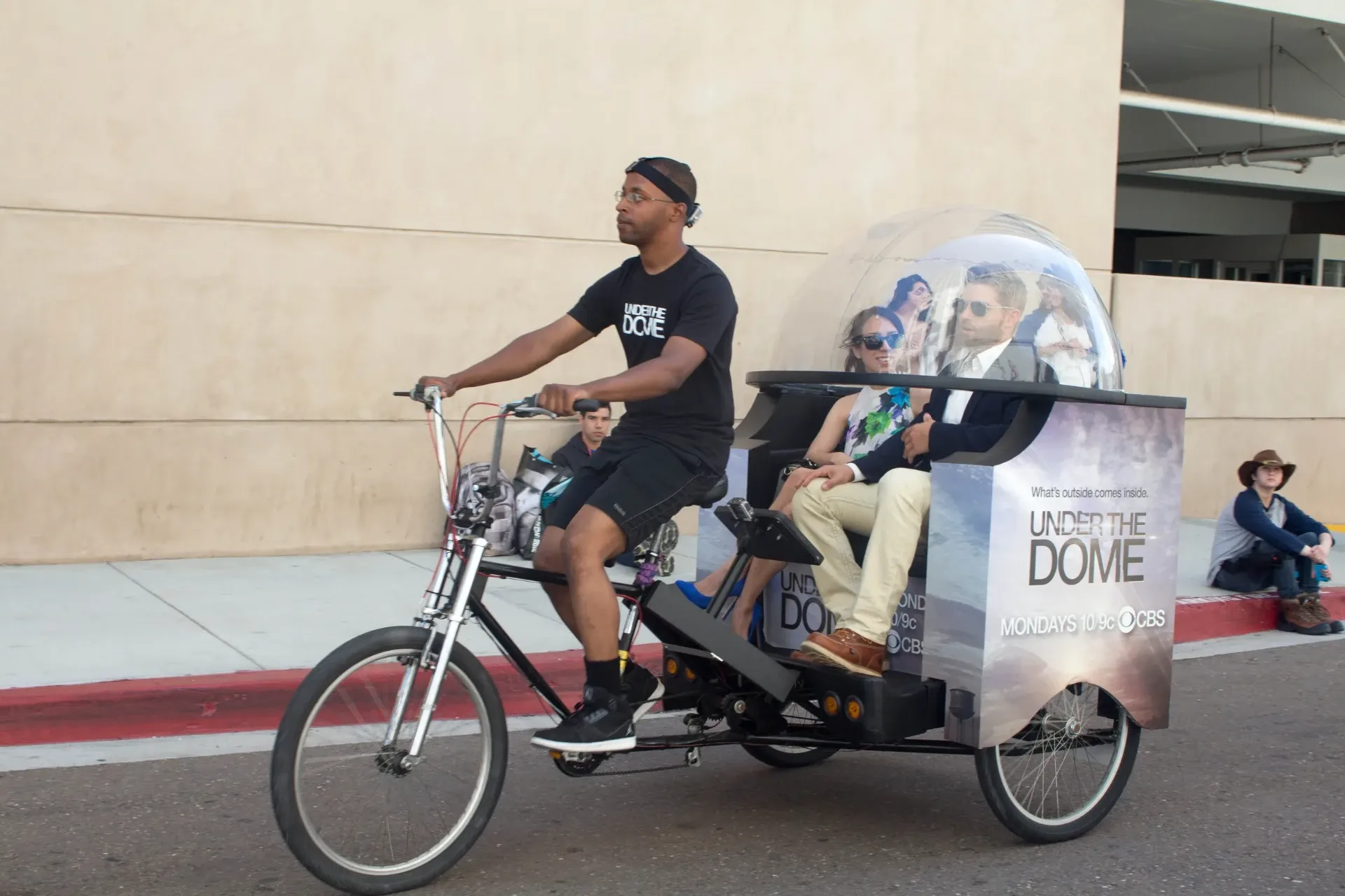 Under the Dome CBS pedicab with dome prop driver Convention Center Comic-Con