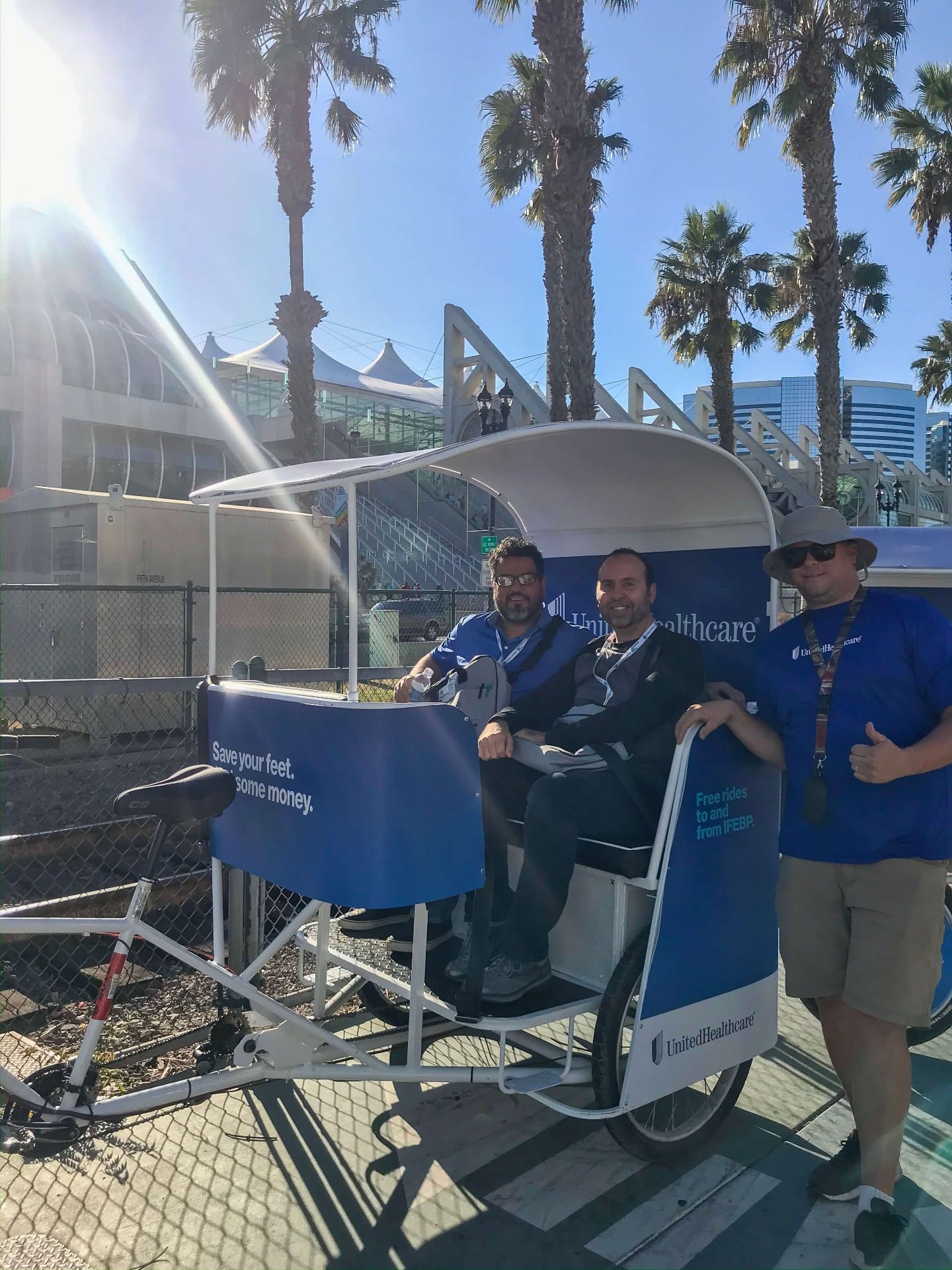 UnitedHealthcare pedicab crew giving thumbs up at San Diego Convention Center