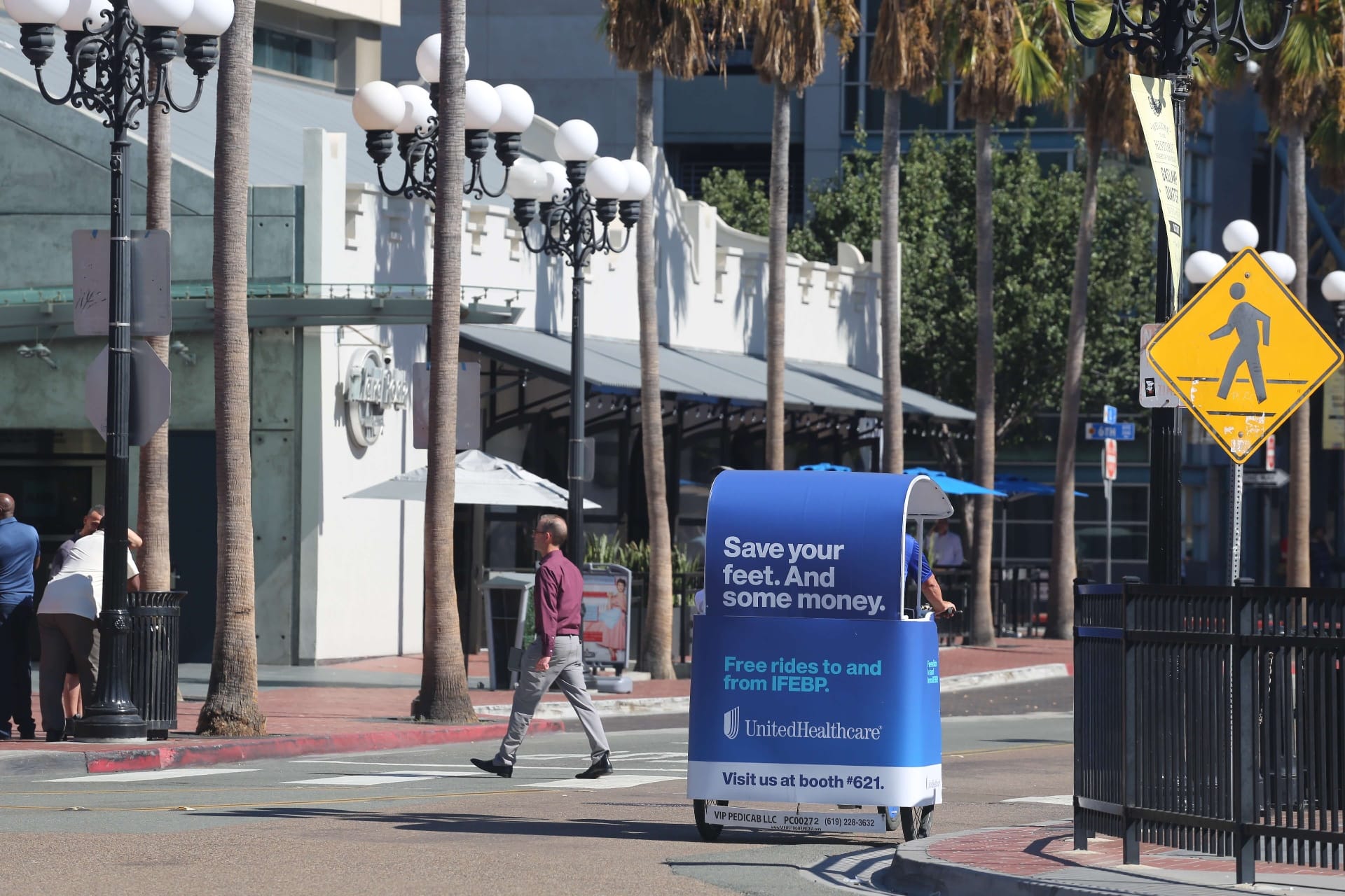 UnitedHealthcare pedicab cruising daytime downtown San Diego street