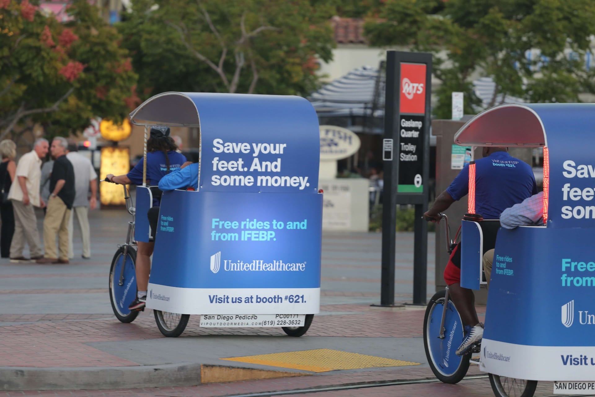 UnitedHealthcare pedicab fleet at Gaslamp Quarter trolley station San Diego
